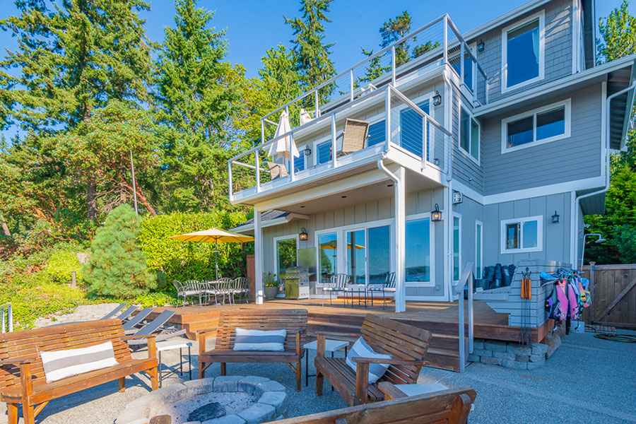 Image showing back of house with patio seating and fire pit